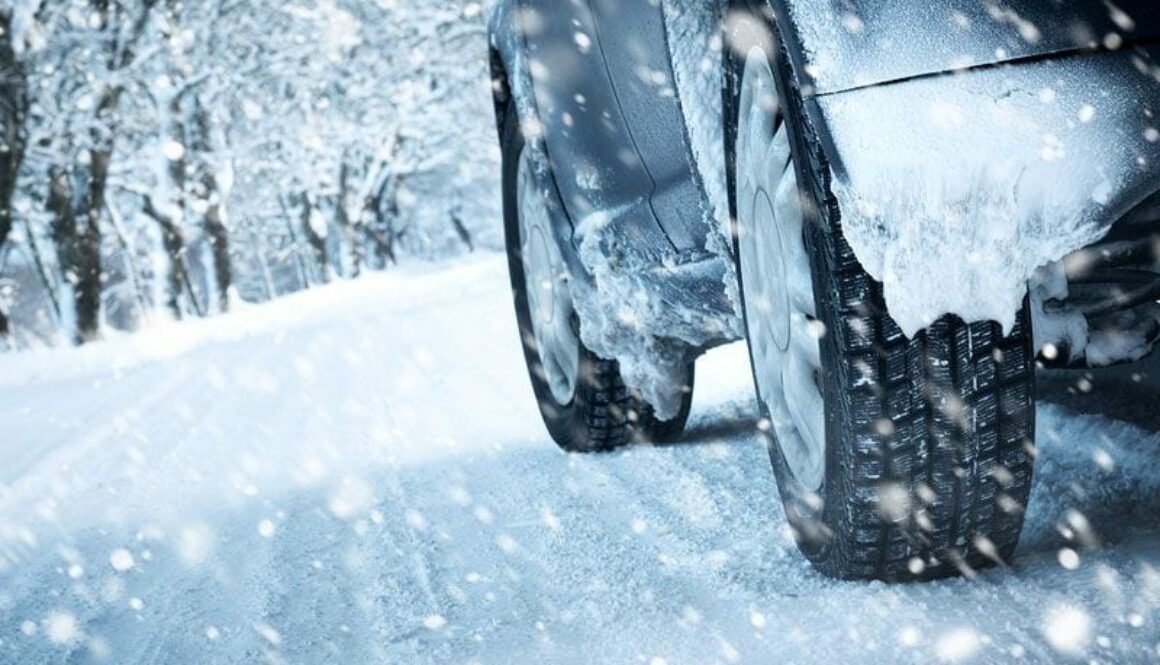 driving-in-blizzard-tire-close-up-in-snow